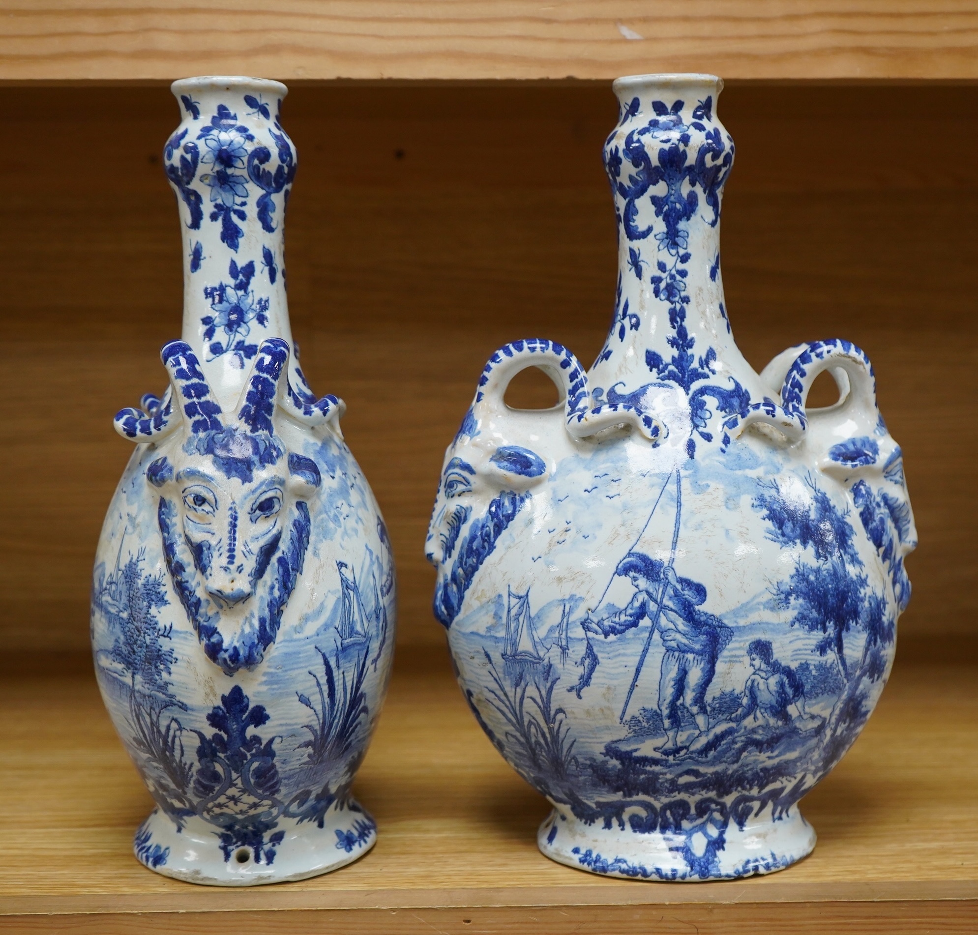 A pair of mid 18th century Delft blue and white flagons